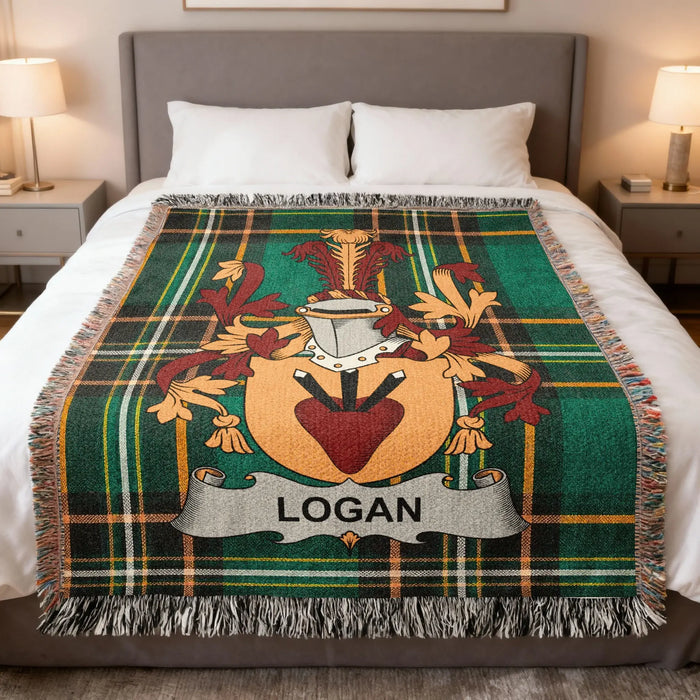 Logan family crest Irish National Tartan woven blanket displayed on a bed.