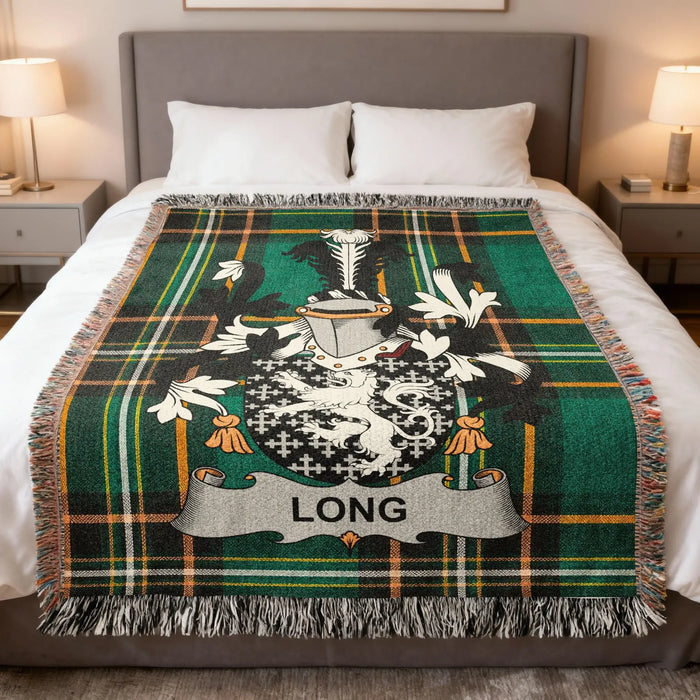 Long family crest Irish National Tartan woven blanket displayed on a bed.