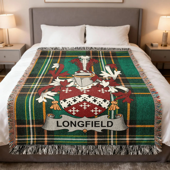 Longfield family crest woven blanket spread across a bed.