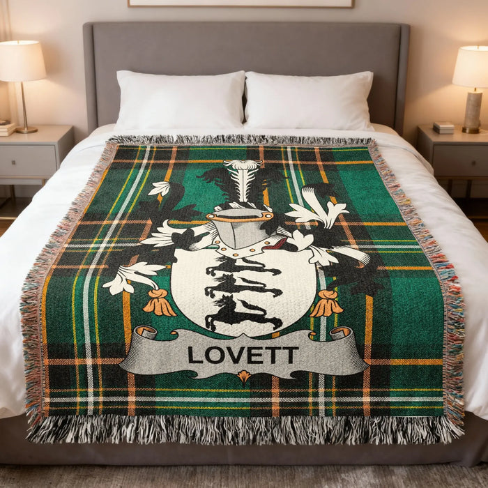 Lovett family crest Irish National Tartan woven blanket displayed on a bed.