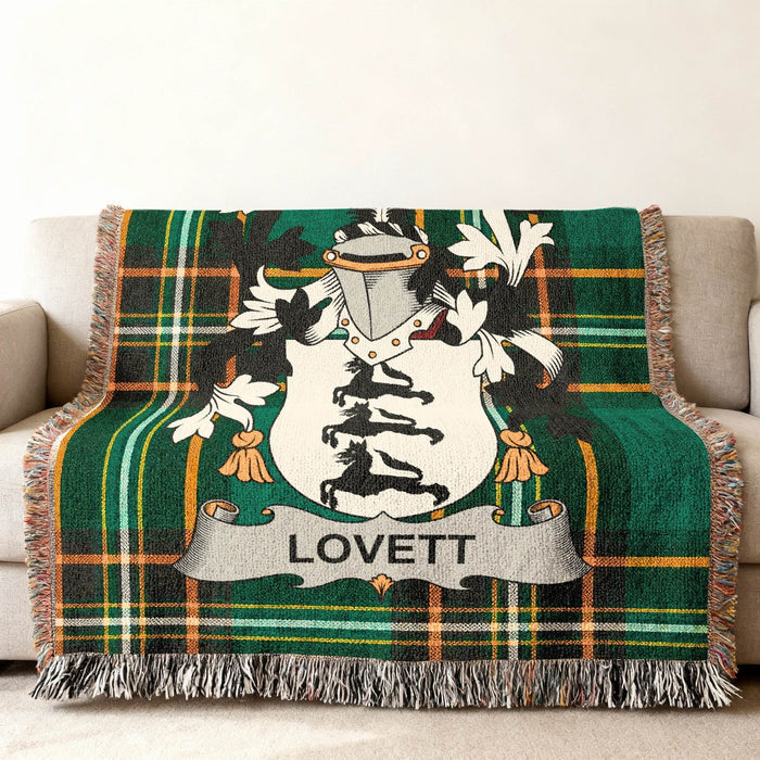 Close view of the Lovett family crest woven into Irish National Tartan cotton fabric.