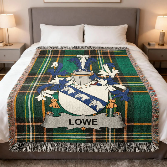 Lowe family crest Irish National Tartan woven blanket displayed on a bed.