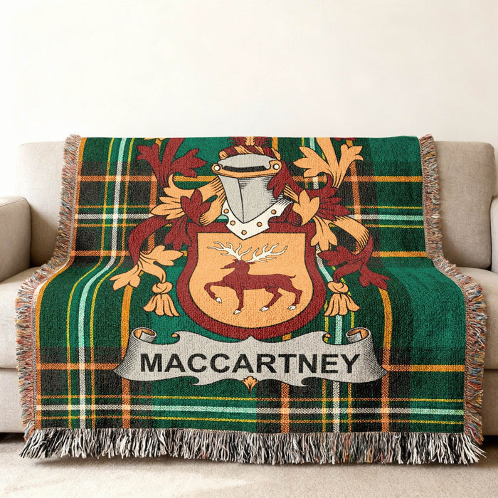 Close view of the MacCartney family crest woven into Irish National Tartan cotton fabric.