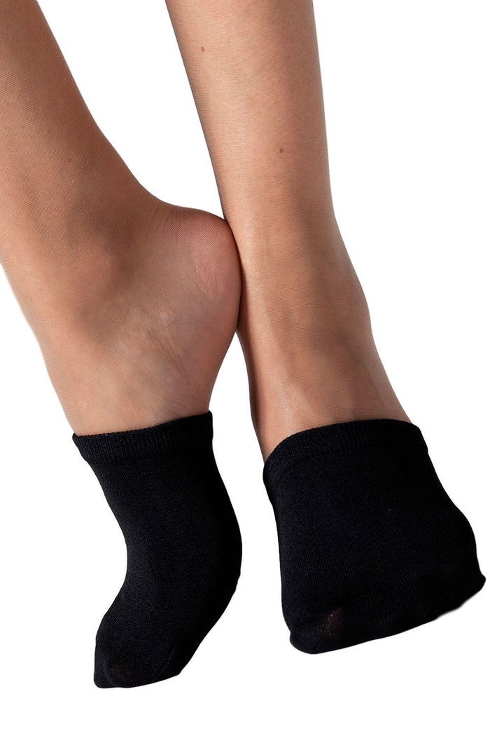 Black mule socks worn by a model on a white background