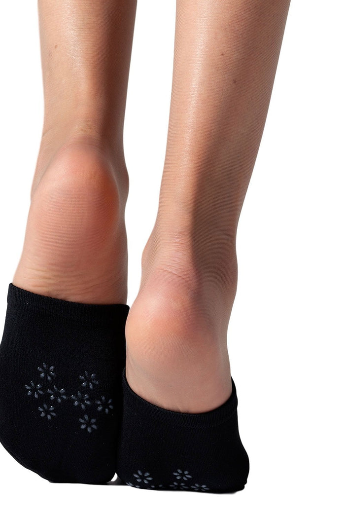 Black mule socks worn by a model on a white background
