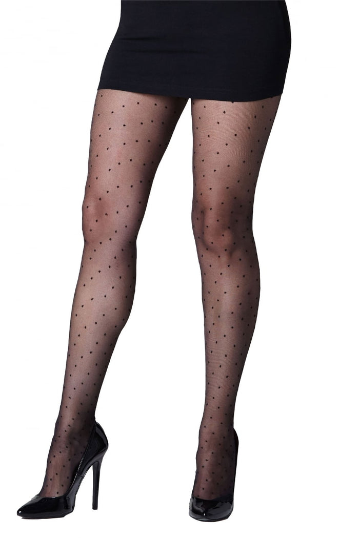 Black polka dot tights worn with a black skirt and high heels on a white background