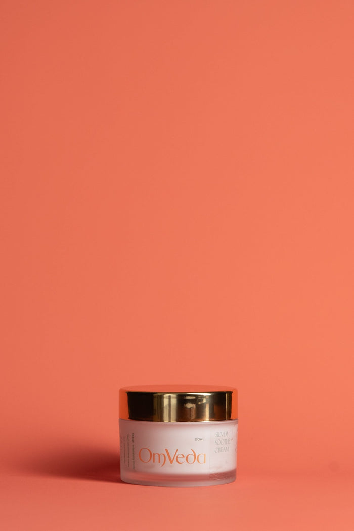 OmVeda Silver Soothe Cream jar with gold lid