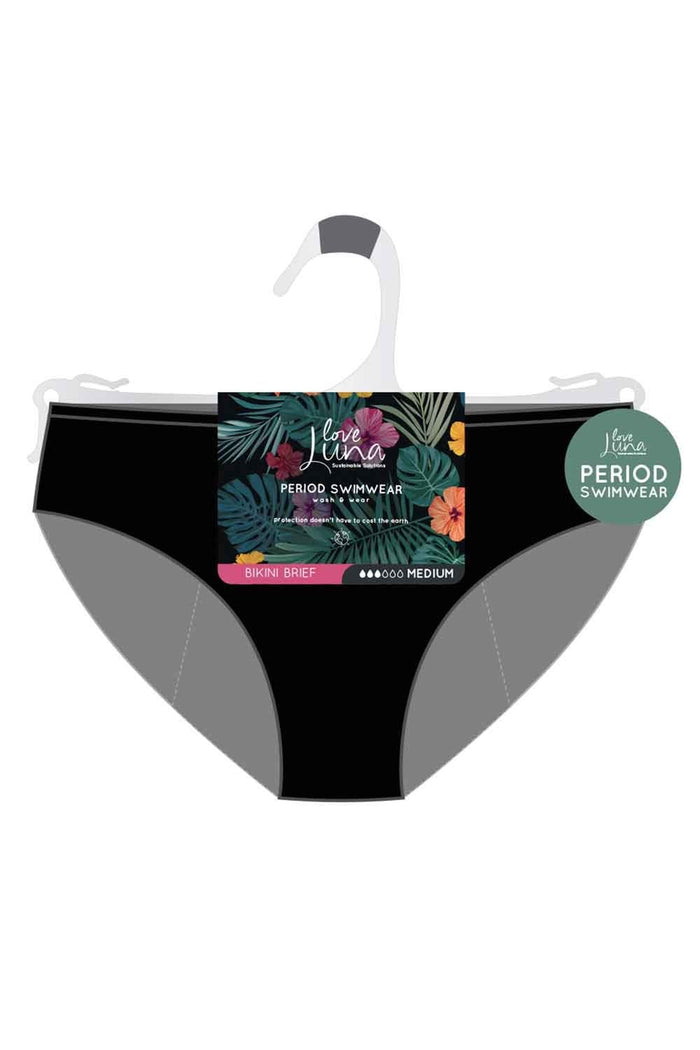 Black period bikini brief swimwear on a hanger with a colorful label on a white background