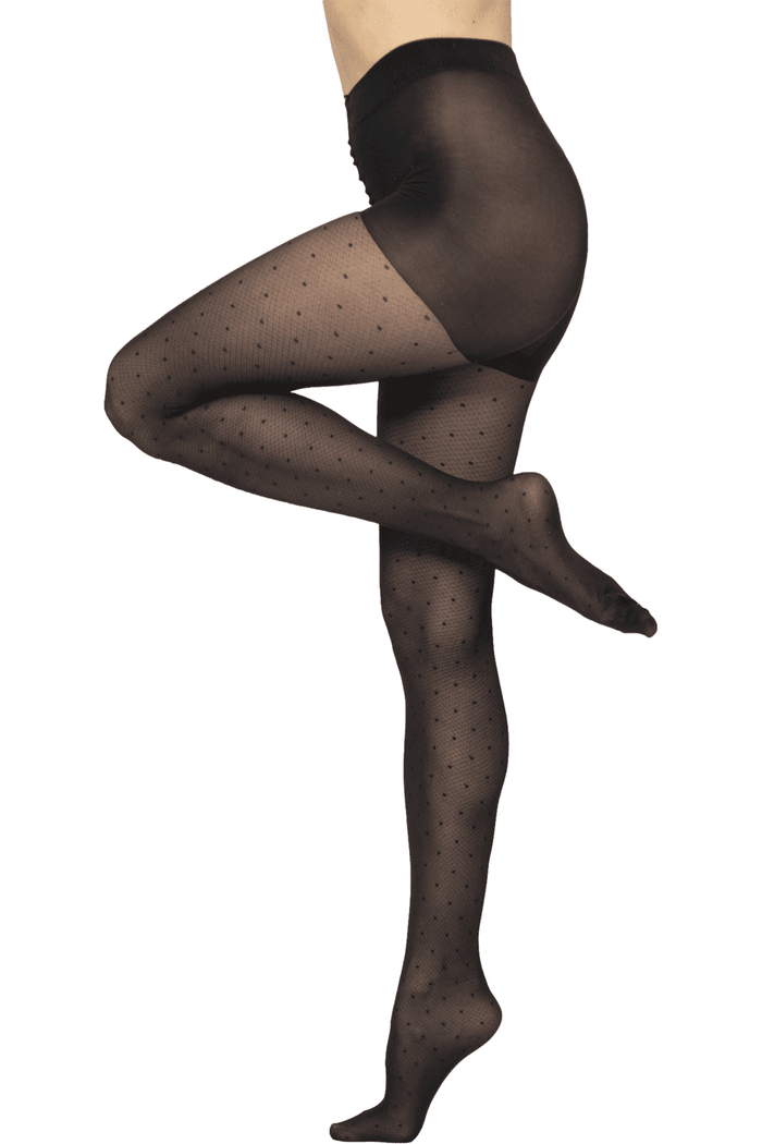 Black patterned polka dot tights worn by a model on a white background