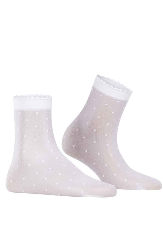 White socks with subtle polka dot pattern on a white background