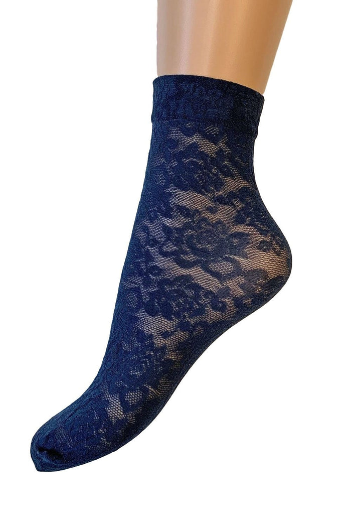 Primrose lace sock on a mannequin foot against a white background