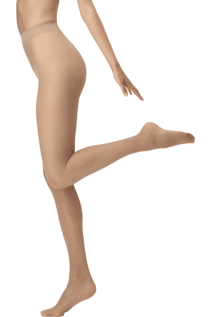 Nude tights worn by a model on a white background