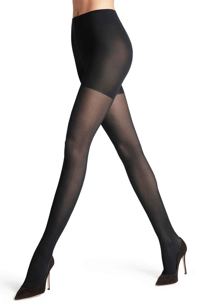 Black tights worn by a person on a white background