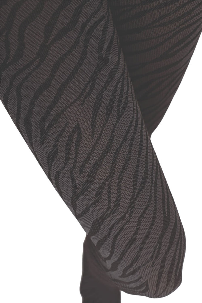 Grey patterned serpent tights on a white background