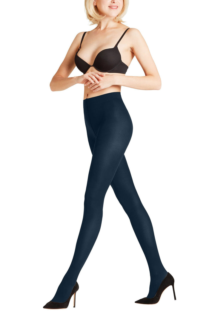 Woman wearing marine  tights and a black bra on a white background