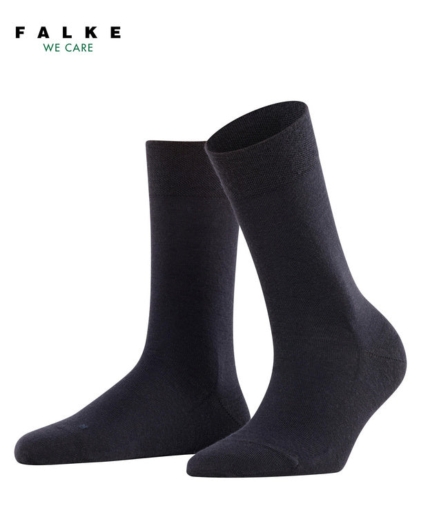 Pair of dark navy sensitive berlin  Falke socks on a white background