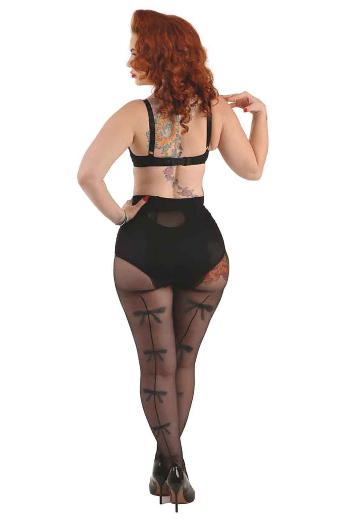 Model wearing bow backseam tights  on a white background