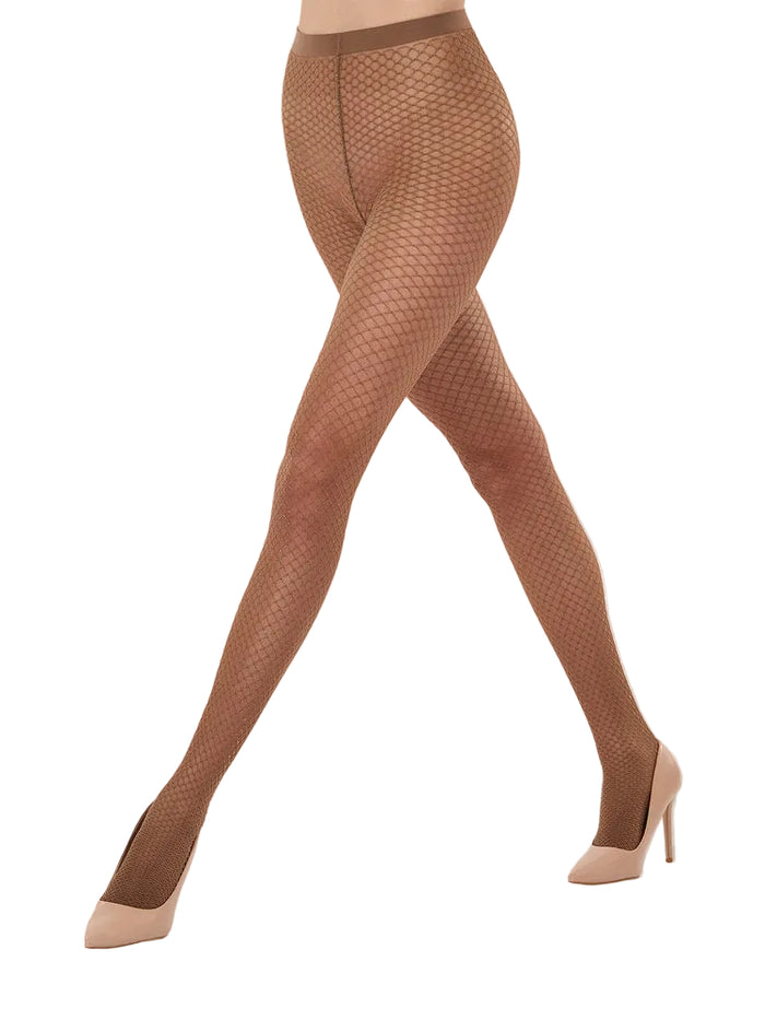 Wolford patterned Shimmer effect tights worn on model with white background.