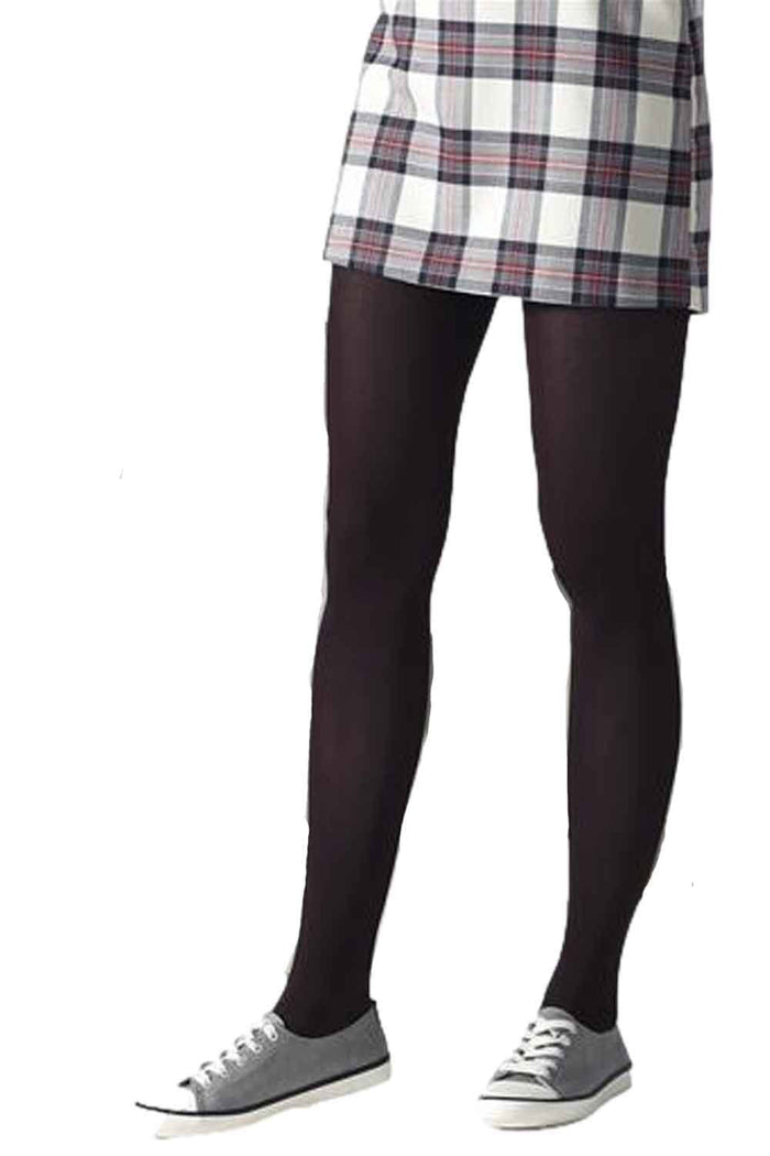Model  wearing Gipsy shimmering tights, a plaid skirt, and gray shoes on a white background