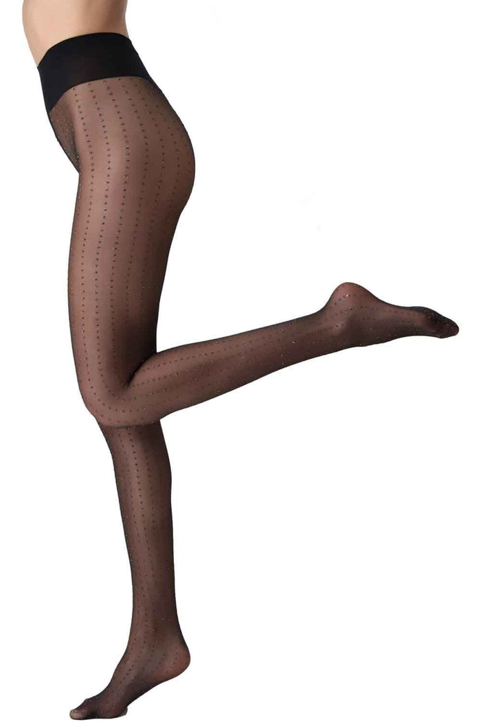 Black/silver glitter patterned tights worn by a person on a white background