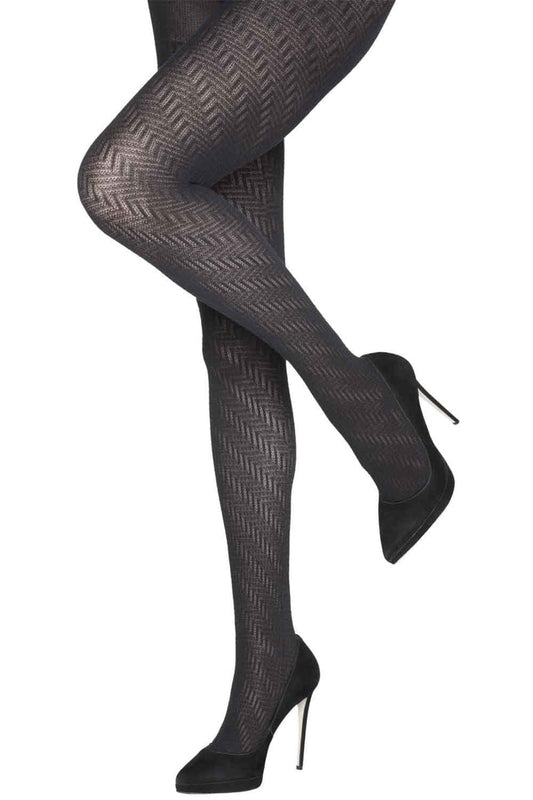 Black zig zag  patterned tights worn with black high-heeled shoes on a white background