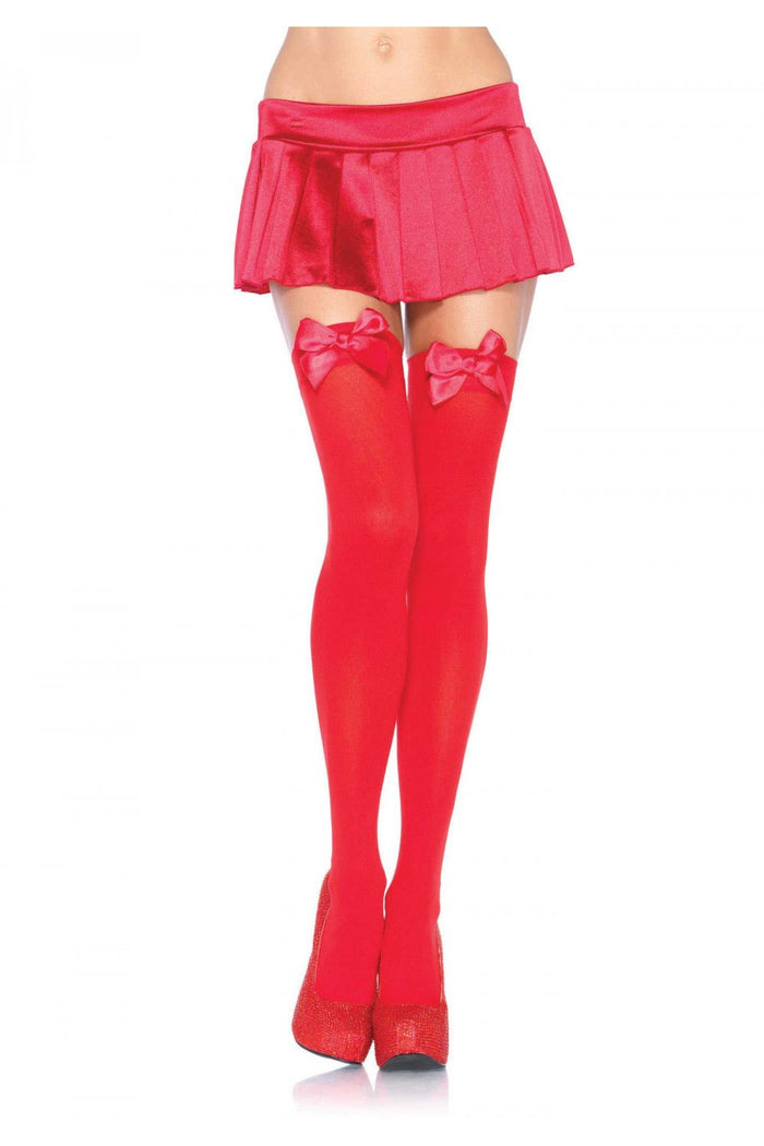 Red skirt, red thigh high socks with red bows, and red high-heeled shoes on a white background