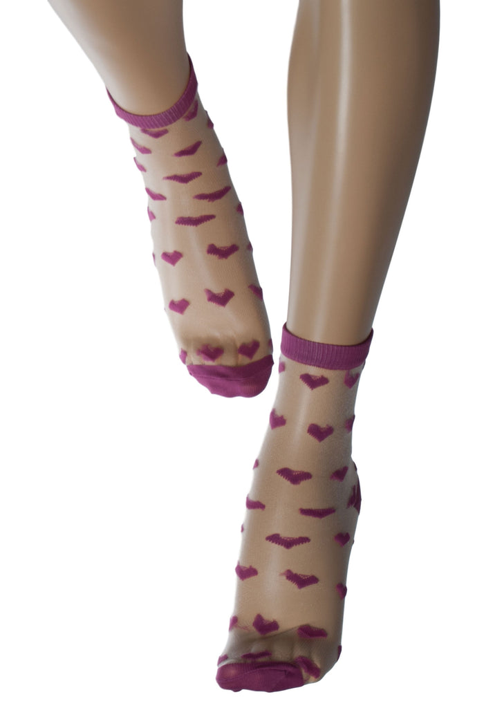 Sheer socks with pink hearts on a white background
