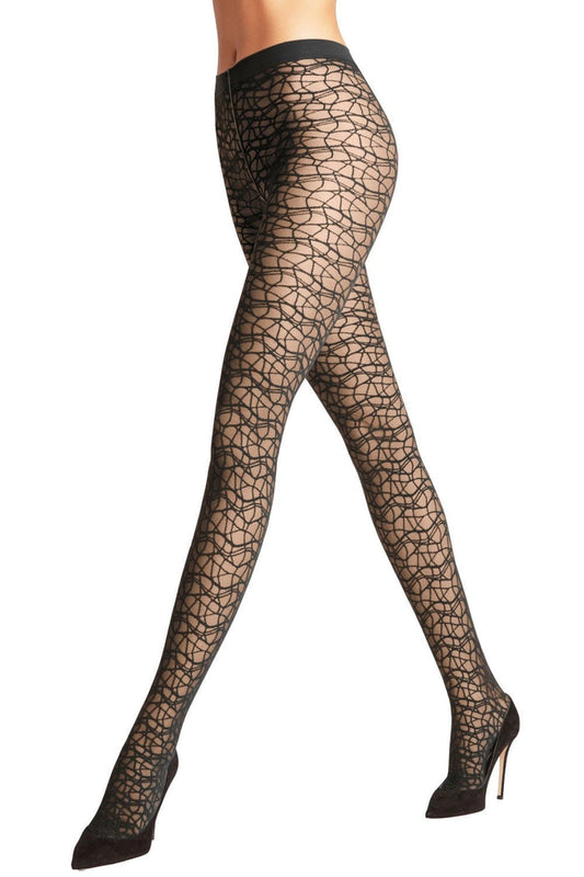 Black twisted lace tights worn by a model on a white background