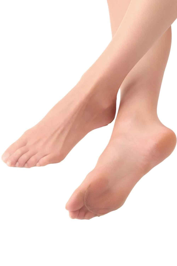 Close-up of a person's feet wearing transparent v slim tights on a white background