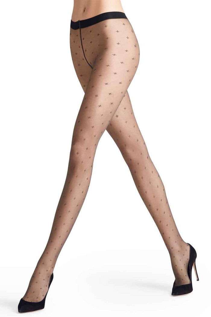 Sheer patterned tights worn by a model on a white background